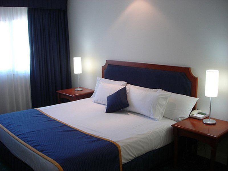 فندق Hyatt Regency بريزبين الغرفة الصورة A bedroom in a hotel